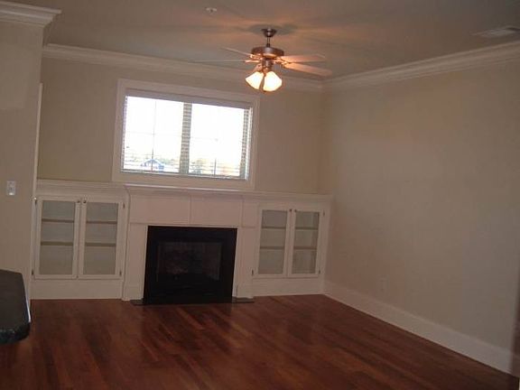 View of Living Room with fireplace and custom built ins