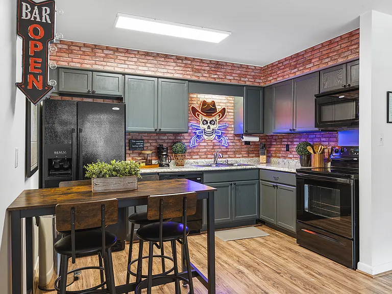Fully equipped kitchen for all of your cooking needs! Dining table with seating for 4.