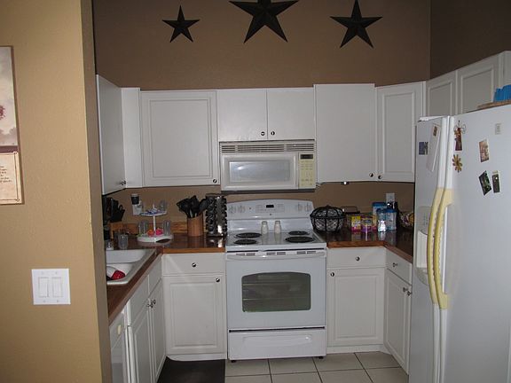 Kitchen countertops, sink, appliances (includes dishwasher which is not easy to see in this pic) and cabinets