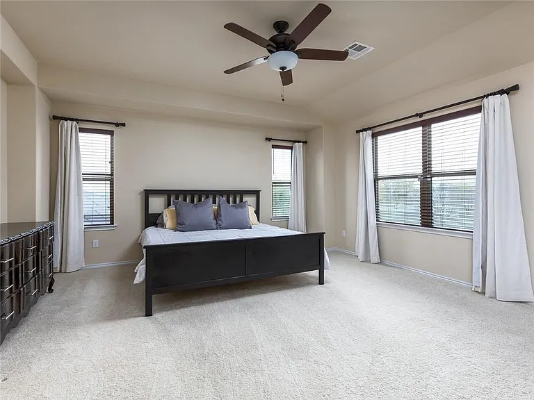 Master bedroom with no neighbor behind - sometimes you can watch horses run around on the field