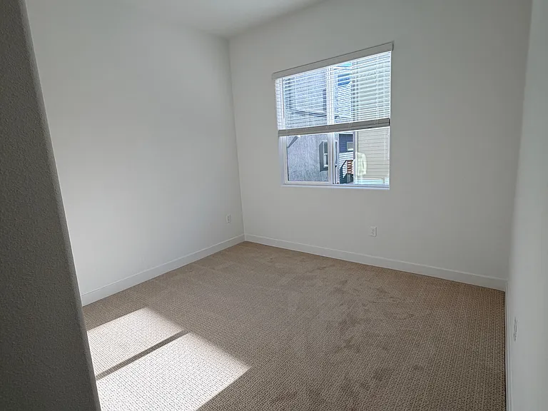 Main floor bedroom with shared bathroom