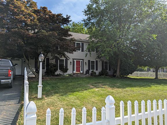 The entire yard - front, side, and back - is fenced in for kids and dogs.