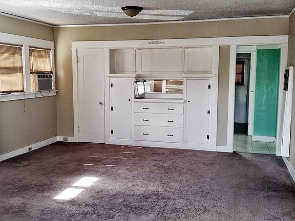 Living room with fireplace and built ins