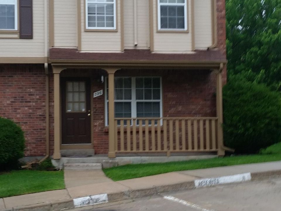Front elevation end unit with reserved parking.