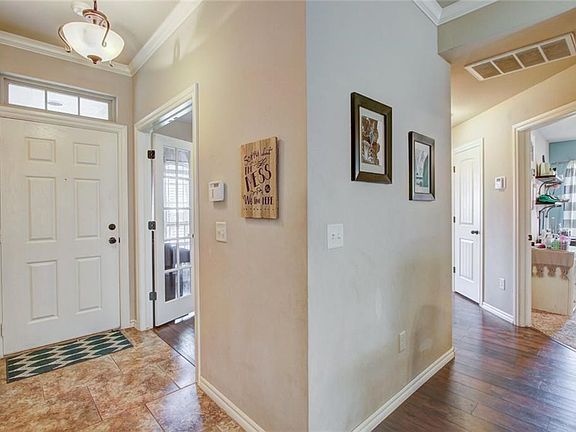 Foyer with doors leading to the office and the hall way to Bedrooms #2 and #3 and bath.