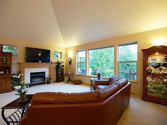 Soaring ceilings in the living room, dining room, and kitchen