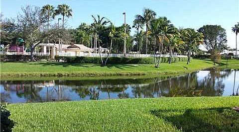 View of the lake, pool and tot lot from the home.