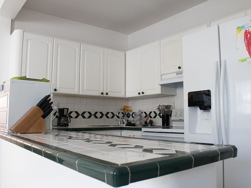 Kitchen area with full fridge and freezer.
Very convenient kitchen island. Lots of cabinet space under the island and counters as well.