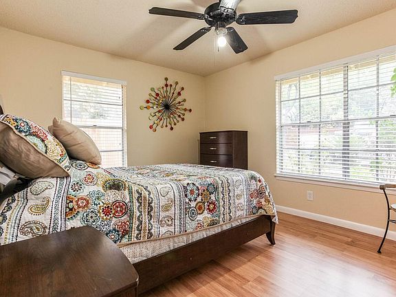 Bedroom 1, the larger of the two. Queen bed, dresser, nights