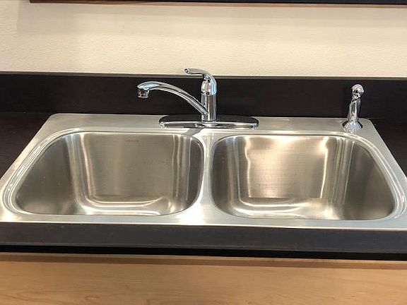 Stainless steel sink. Extra deep sink. Paperstone counter top.