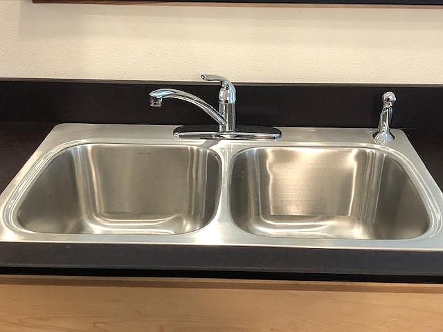 Stainless steel sink. Extra deep sink. Paperstone counter top.