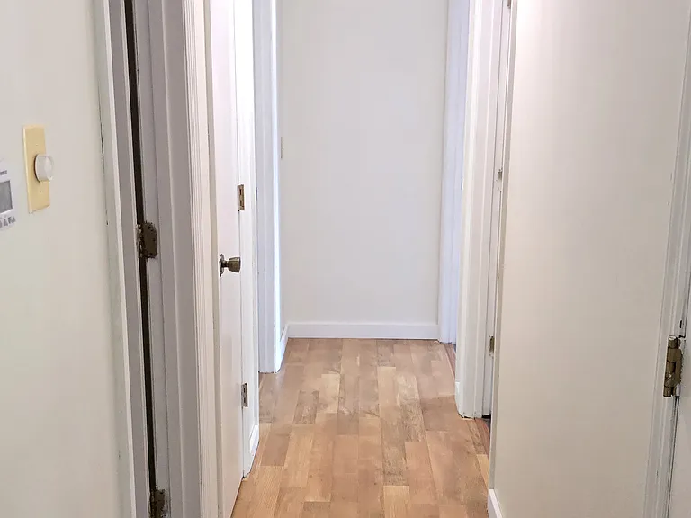 Hallway to main bathroom and bedrooms