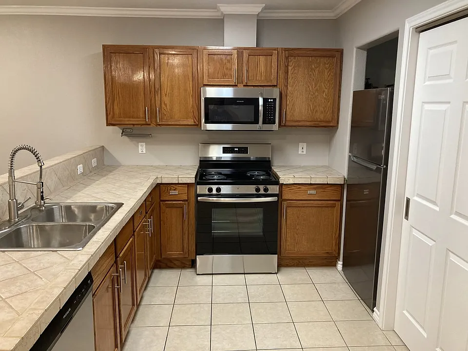 Brand new stainless steel appliances and beautiful crown molding