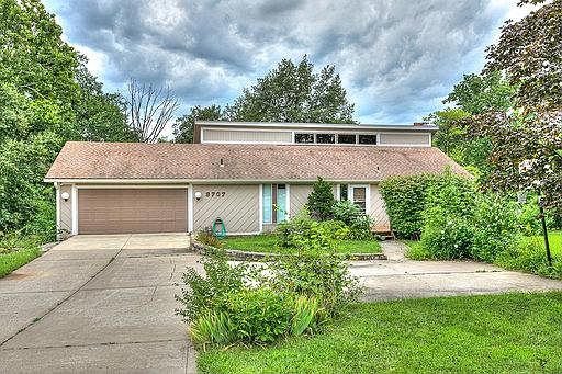 2 car garage with openers. Extra parking with basketball goal in front.