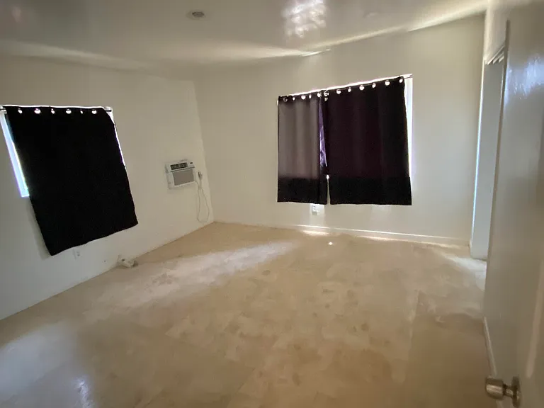bedroom with travertine flooring
