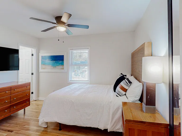 12x12 room with dresser, large closet, 50" TV and private bathroom.