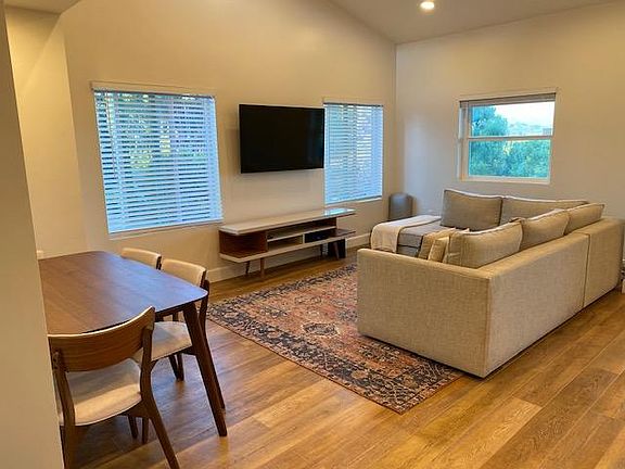 Living room. Vaulted ceilings, open to kitchen.