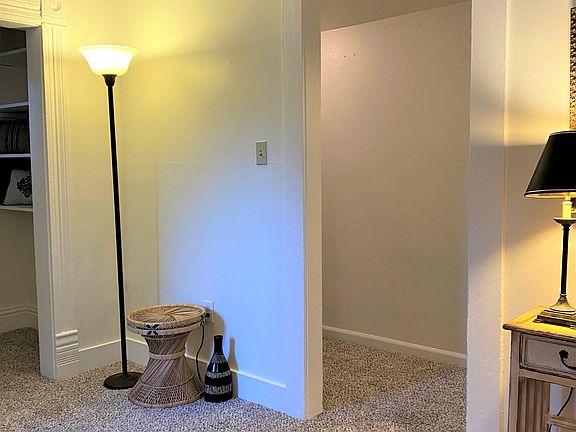 Livingroom to hall leading to back bedrooms and bathroom