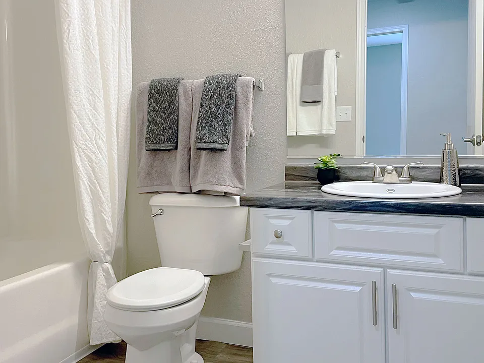 Clean, functional bathrooms feature a full bathtub for comfortable bathing, professionally operated by Highlands Vista Group.