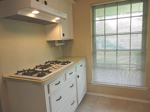 5 Burner Gas Stove in this sun drenched kitchen - walk in pantry - awesome storage space!