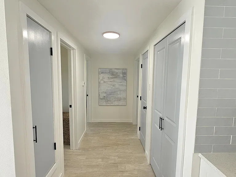 Hallway to bath & bedroom