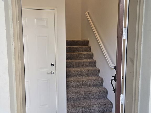 Front door, with door to garage