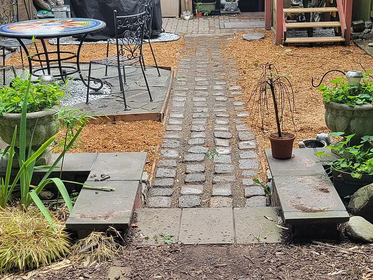 from the back area of backyard/garden 20 x20 with walk down to another 20x40 space sufficient for family PARTY