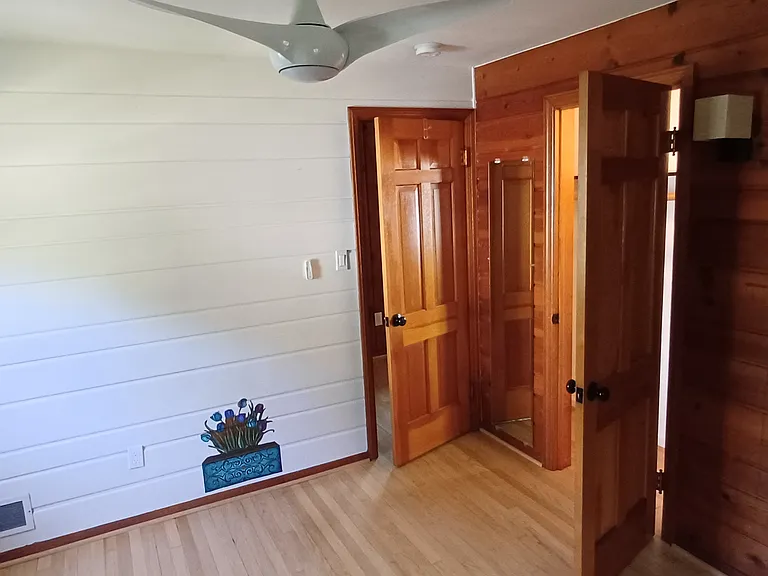 Bedroom 3. Closet to right. Bedroom door to hall (center).