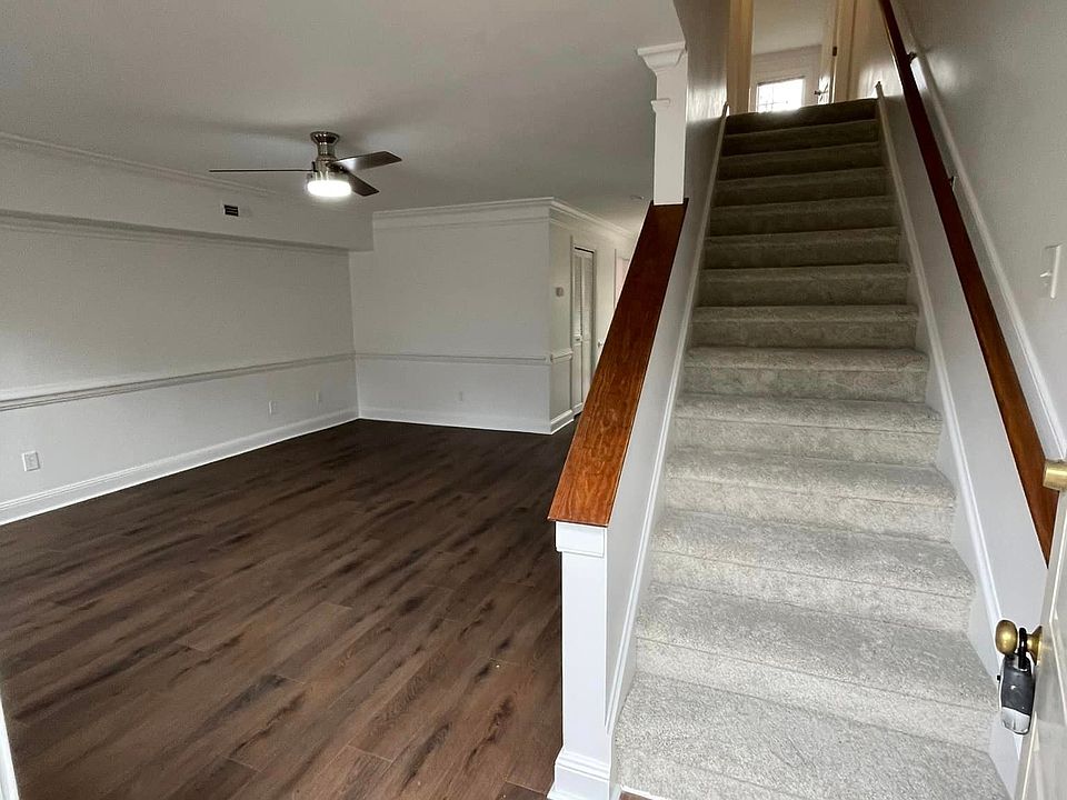 Entry from front door. LVP flooring downstairs carpeted stairway, landing, and bedrooms. Please Note: paint color may vary.