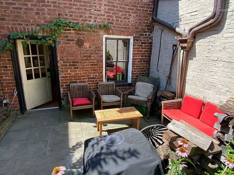 kitchen opens to back patio with seating