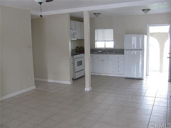 Kitchen opening to living area