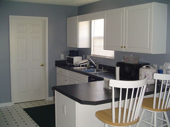 What a great kitchen with tons of cabnets and light.  
