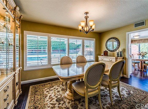 Formal Dining Room, with vaulted ceilings, looks onto backyard views