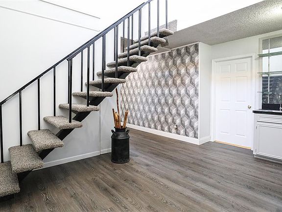 Staircase leads to bonus game room upstairs.