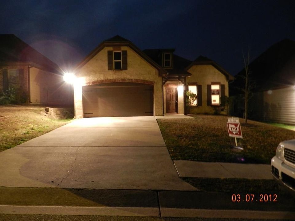 Front of home at night.