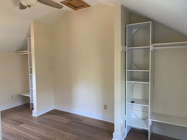 Master bedroom with his and her closet. Vaulted ceiling
