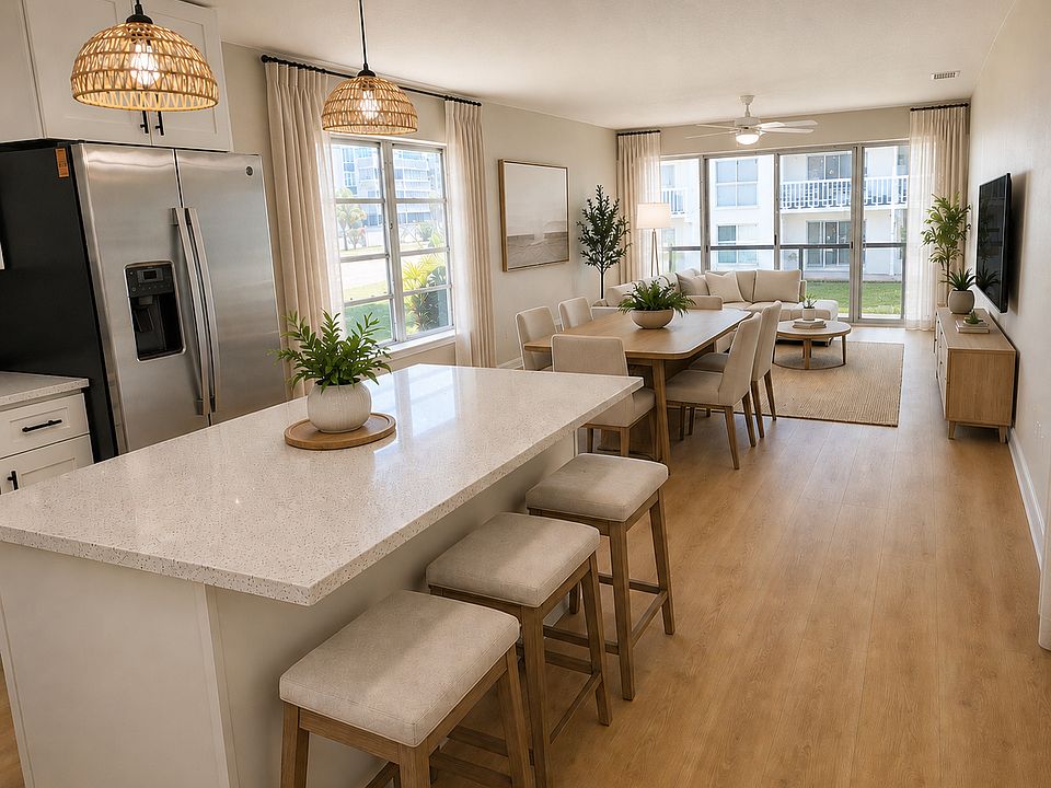 Bright, open kitchen, dining and living area with lots of natural light.