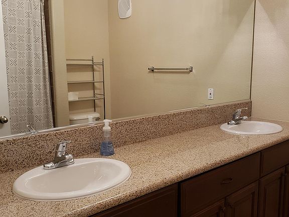 Bathroom 2 - granite counter, dual sinks and walk-in shower.