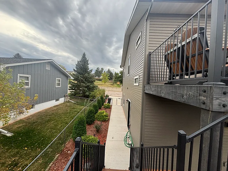 sidewalk to entry from backyard, and deck