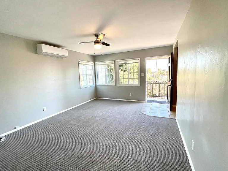 Living room and entry, looking east from the bedroom door.
