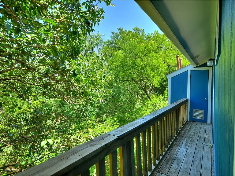 2nd floor balcony overlooking greenbelt shared by both bedrooms.