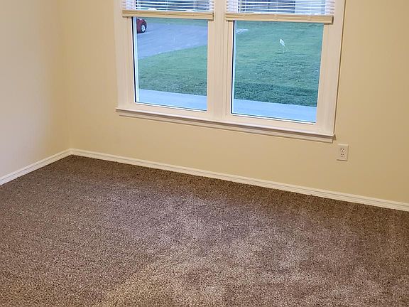 Front upstairs bedroom with new carpet and flooring throughout the apt.
