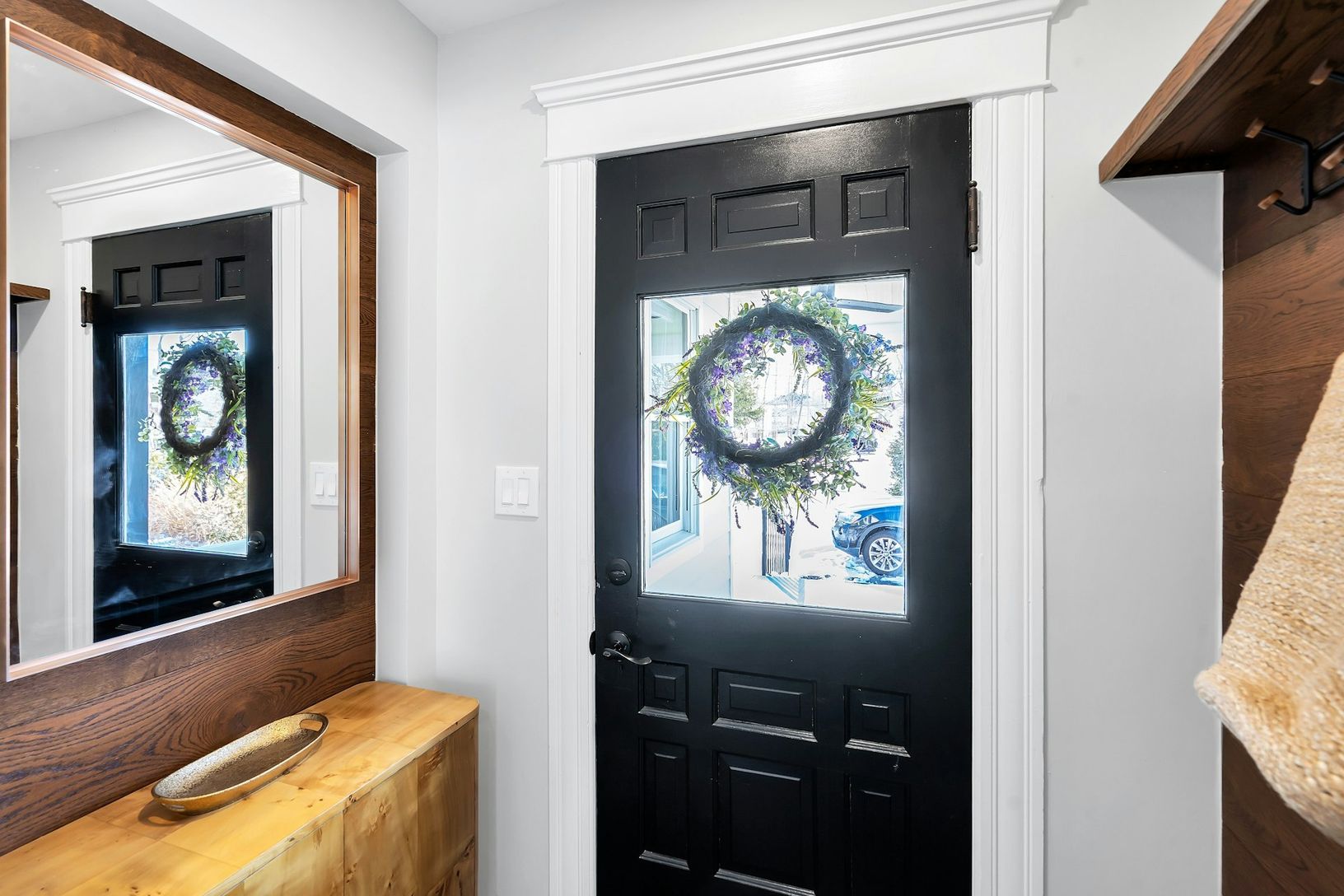  Entrance foyer with wall of coat hooks.