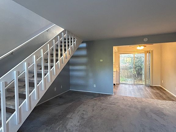stairs to 2 bedrooms and full bath upstairs
living room: carpeted
dining area: hardwood floor