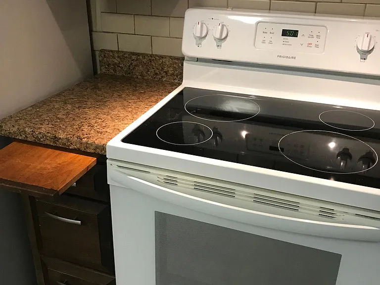 Nice pull out cutting board by the stove. Amazing how fast the stove heats!