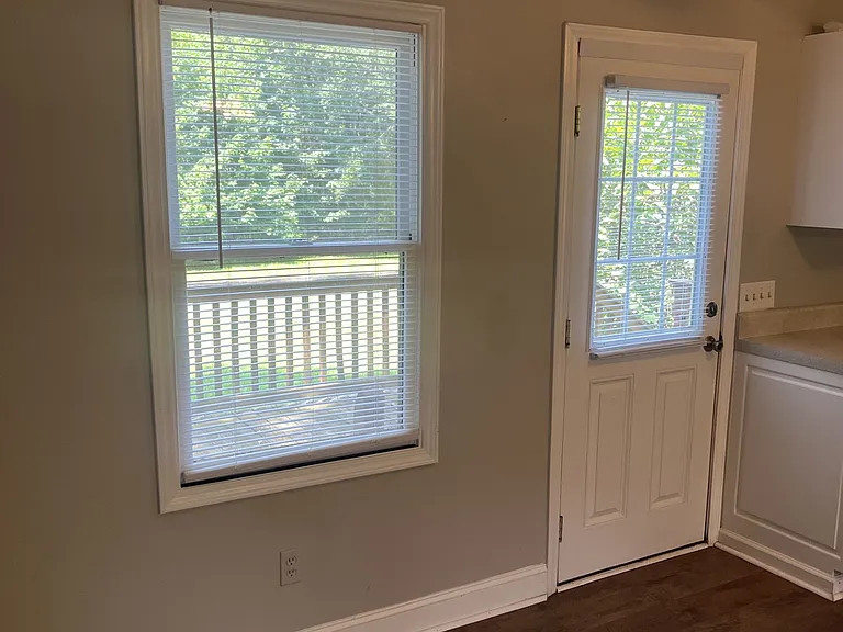 Back Door to spacious yard- Located in Kitchen