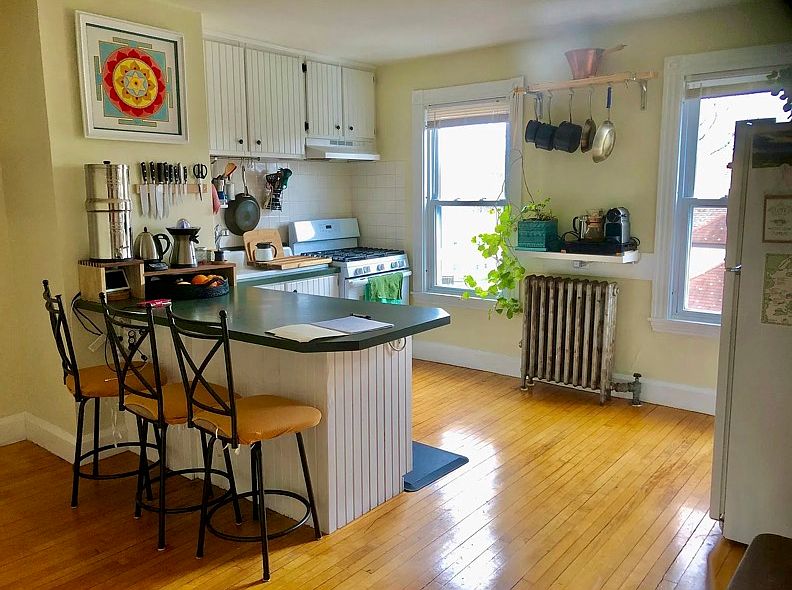Similar kitchen, (cabinets are wood stain and new countertops coming in)