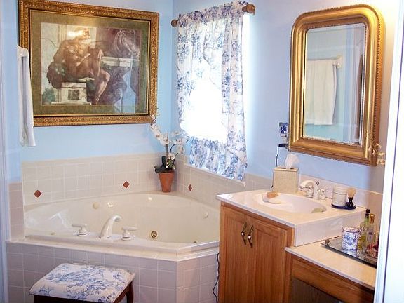 Luxurious jetted tub, double vanities and private shower