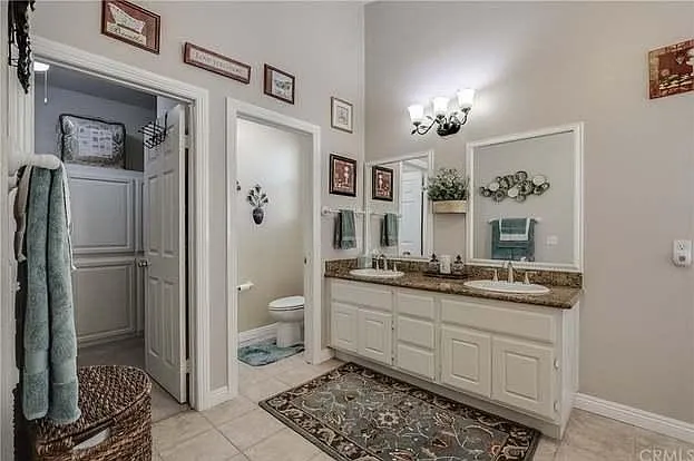 Master Bedroom Restroom. Which includes a tub and a huge closet for 2.
