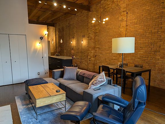 End-to-end brick wall. 15 foot ceilings.